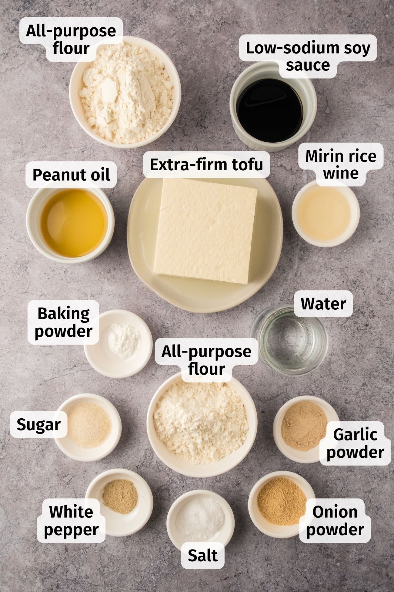 The ingredients for crispy fried tofu in individual bowls on a table, labeled.