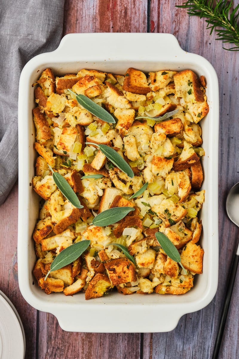 A top-down view of a casserole dish filled with vegan stuffing.