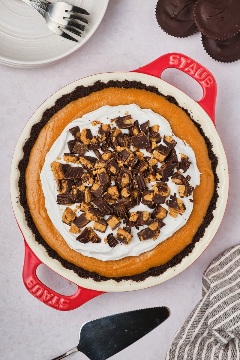 Vegan peanut butter cups, chopped and sprinkled on top of a vegan peanut butter pie.